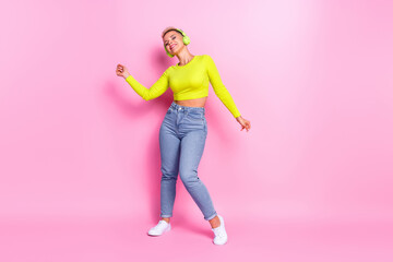 Fototapeta na wymiar Full size photo of overjoyed satisfied lady dancing enjoy listen favorite song isolated on pink color background