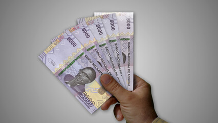 Angola Kwanza growing pile of money in hand concept 3d illustration