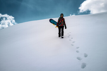 Girl snowboarder enjoys winter sport