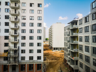 construction site of concrete high-rise buildings. Construction of apartments in a new residential complex