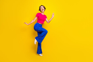 Fototapeta na wymiar Full length photo of positive glad lady good mood have fun cool offer empty space isolated on yellow color background