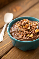 Chocolate pudding on a wooden table