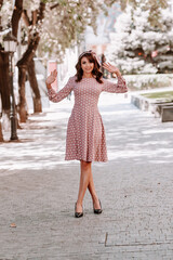 beautiful woman in pink dress with white polka dots