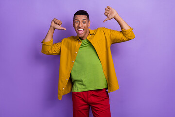 Photo of funky funny guy dressed yellow shirt pointing thumbs himself isolated purple color...