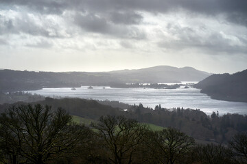 Lake Windermere and the surrounding forest from High Skelghyll Farm on a cold winters morning in the Lake District Cumbrian Mountains, England, UK.