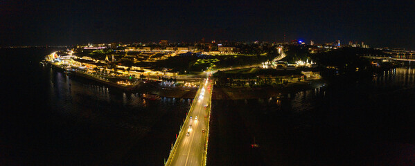 Nizhny Novgorod at night. Automobile traffic on the Kanavinsky Bridge. Aerial view.