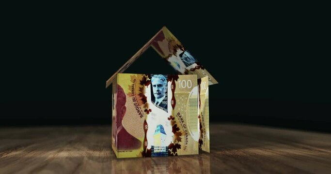 Canadian dollar 100 CAD money banknotes paper house on the table. Canada currency notes 3D concept of home mortgage loan, debt, rent, liabilities and building wealth.