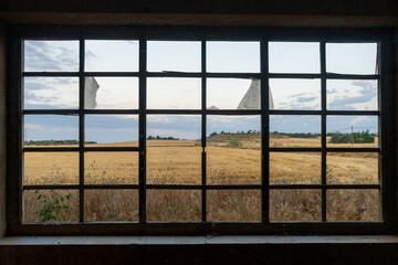 wheat fields view from broken window