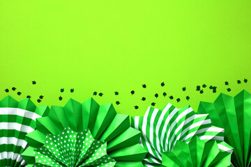 Frame border of green paper fans and confetti. Saint Patricks Day banner design, flyer, party invitation card template.