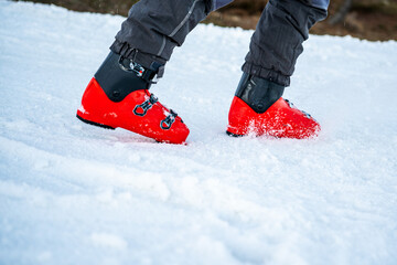 Ski boots walking through the snow.