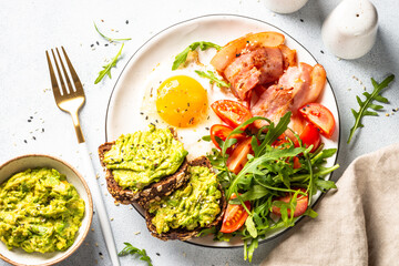 Healthy breakfast or lunch. Beacon, eggs and fresh salad.