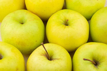 Multitude of yellow apples, useful as a background. Apple is often indicated for an healty diet, including vegetarian.