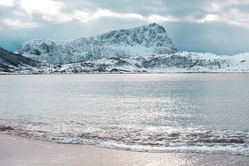 Amazing mountains in Norway. Lofoten with sunset colors and ocean, sea