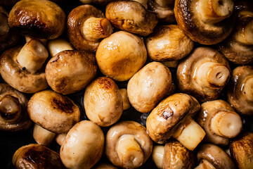 Fragrant fried mushrooms. Macro background.