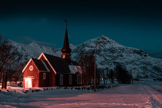 Church in Lofoten, Norway Flakstad during night with stars and mountains in background 
