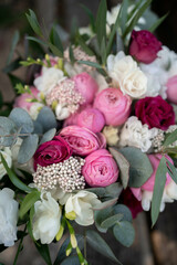 Wedding bouquet composed of roses, ozothamnus, freesia and eucalyptus. Pink bridal bouquet. Wedding day.