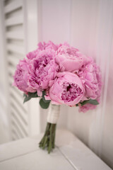 Pink wedding bouquet of peony. Sarah Bernhardt peonies. Wedding day.