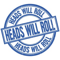 Fototapeta premium HEADS WILL ROLL written word on blue stamp sign
