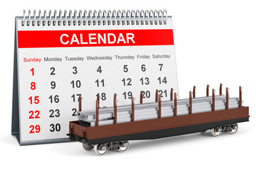 Desk calendar and railroad car with stack of rolled metal products