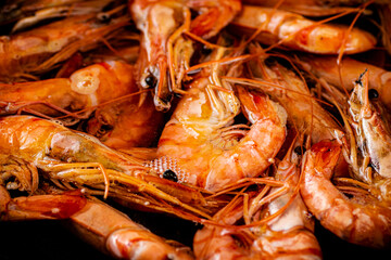 Red shrimp are boiled in water. Macro background. 