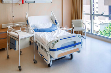 Hospital bed and a place for a newborn baby.