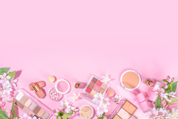 Spring professional makeup flat lay. Spring make up set on pink background. Different make-up...