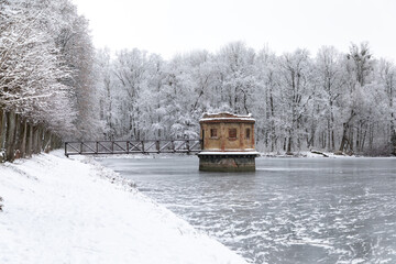 The abandoned water tower on the Willgaiten lake in the winter, Kaliningrad - 564265610