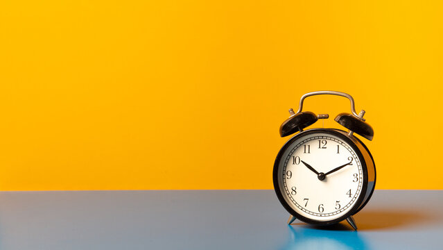 Classic black  clock old vintage alarm, 
Retro alarm clock on table , background with copy space,
Retro alarm morning