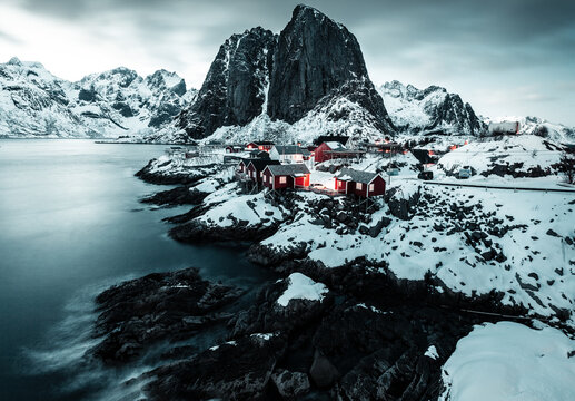 Night long exposure shot, photo in Hamnoy, Small fishing village in Lofoten, Norway during winter with big mountains, peak clouds and amazing view from bridge