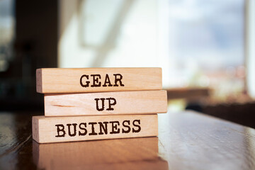 Wooden blocks with words 'Gear Up Business'.