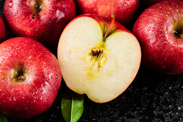 Half and whole fresh apples. 