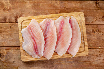 Fresh fish fillet on a cutting board. 