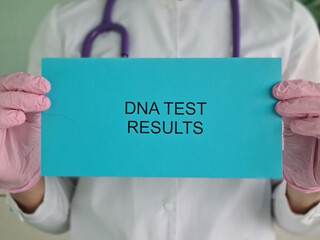 Doctor holds envelope with results of dna genetic study