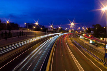 Fototapeta na wymiar Highway car lights at sunset