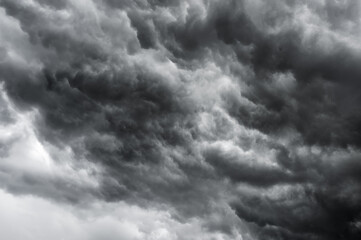 dark clouds black sky in overcast. Heavy rain thunderstorm black wave swirl smoke cloud. Pattern of...
