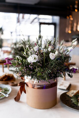 food and decoration of flowers on a festive table in a restaurant