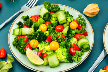 Appetizing salad with physalis, healthy food.