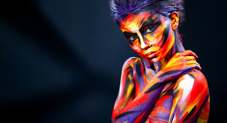 Portrait of the bright beautiful girl with art colorful make-up and bodyart. Download a picture with free space for text. Mockup for a music album. Cover design for e-book. Abstract image