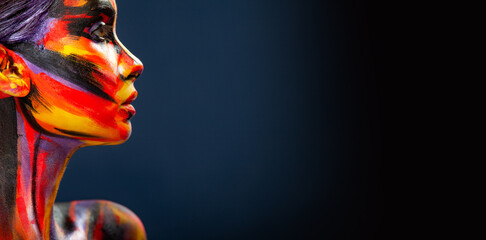 Portrait of the beautiful girl with art colorful make-up and bodyart. Download a picture with free space for text. Mockup for a music album. Cover design for e-book. Abstract image