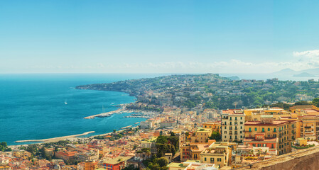 Fototapeta premium Aerial panoramic view of Naples city on the coast of Mediterranean sea, Campania, Italy. Cityscape of Napoli.