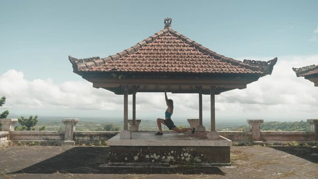 Young healthy girl doing yoga and meditation in the mountains healthy lifestyle