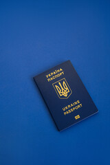 Ukrainian passport on a blue background. Passport of a citizen of Ukraine in macro. Passport General plan and close-up.