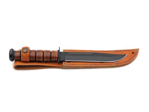 ROME, ITALY - JANUARY 24, 2023. Ka-Bar Military Knife with leather sheath isolated on white background. KA-Bar Knives, Inc is known for high quality military, hunting and outdoor survival knives.