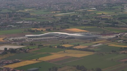 Naples, Italy aerial of Afragola modern train station. Day panoramic view of futuristic construction used as a high-speed railway gateway.