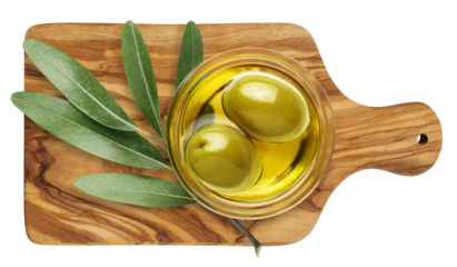 Green olives with leaves on wooden board, cut out