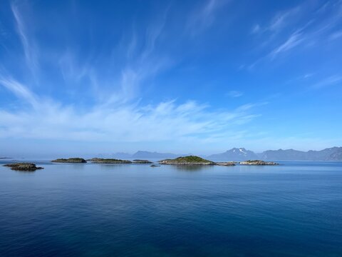 Blue Calm Ocean Bay Horizon, Small Rocky Islands, Blue Sky