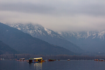 Kashmir, Srinagar India - Jan 10 2023: Popular Srinagar Houseboats in Dal Lake. Colorful Shikara...