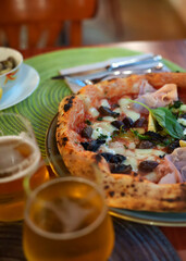 Pizza capricciosa. Pizza with ham, olives, mushrooms and artichokes.