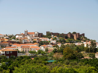 Fototapeta na wymiar Portugal, Algarve, Cityscape of Silves with Moorish Castle and Cathedral on top of the hill