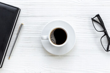 Black coffee - espresso - in white cup on office desk. Time for coffee break